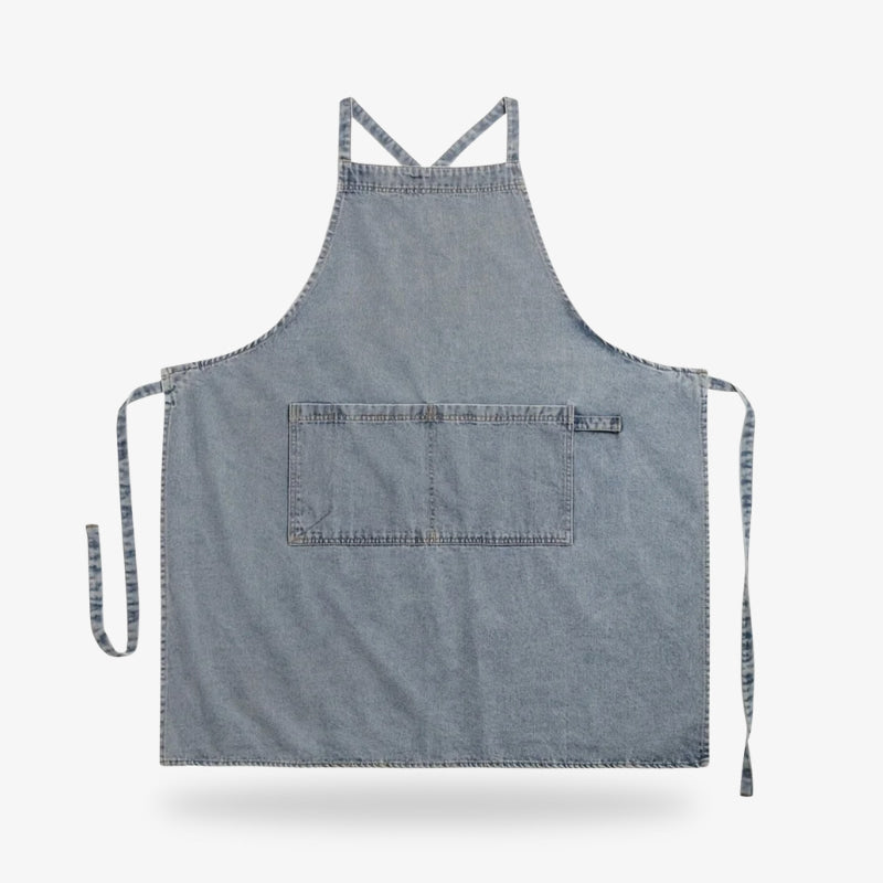 Delantal japonés de denim de alta calidad en azul, diseñado con tirantes cruzados y bolsillo frontal para un uso funcional