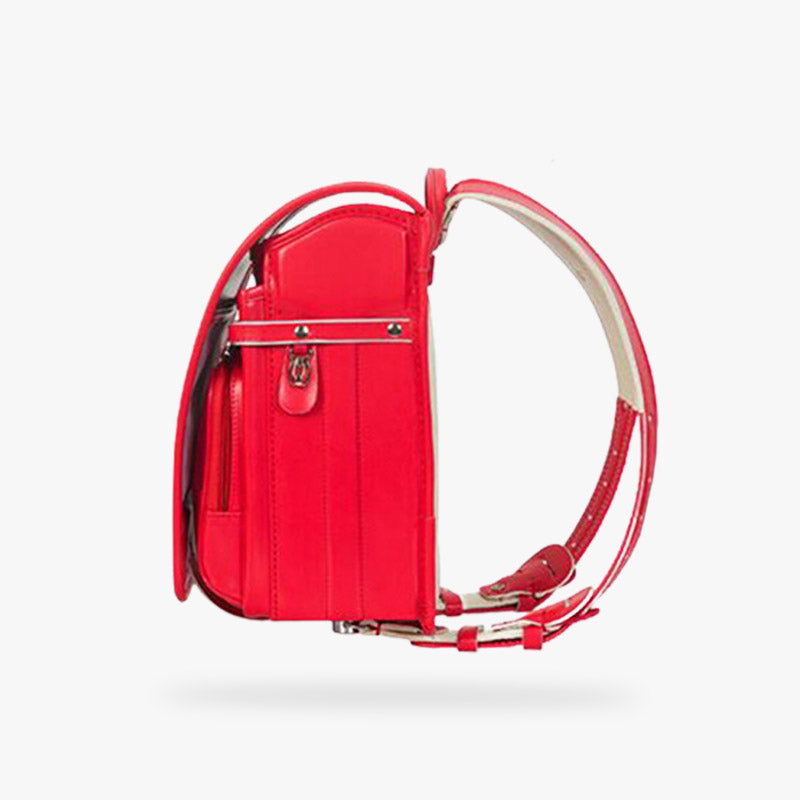 Esta mochila japonesa randoseru roja está hecha de piel y tiene correas para los hombros. Es una mochila japonesa con varios bolsillos. Mochila resistente y práctica