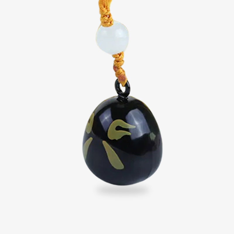 Colgante japonés negro con diseño Daruma, símbolo de protección