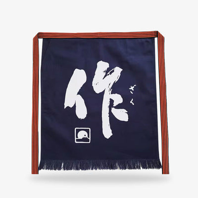 Delantal japonés tradicional con kanji para hombre confeccionado en algodón grueso azul marino, decorado con kanji blanco, ideal para cocineros profesionales y tradición culinaria
