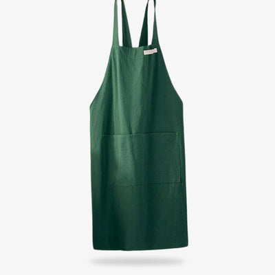 Delantal de lino de estilo japonés que combina fibras naturales transpirables con un diseño de tirantes cruzados para facilidad de uso y larga duración