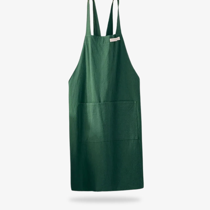 Delantal de lino de estilo japonés que combina fibras naturales transpirables con un diseño de tirantes cruzados para facilidad de uso y larga duración
