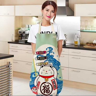 Detalle del estampado del gato Maneki Neko en el delantal