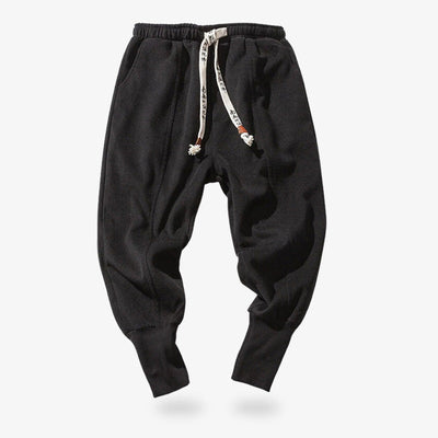 Pantalones Nikka zubon negros anudados con cordones de estilo kanji, ideales para un armario streetwear y zen