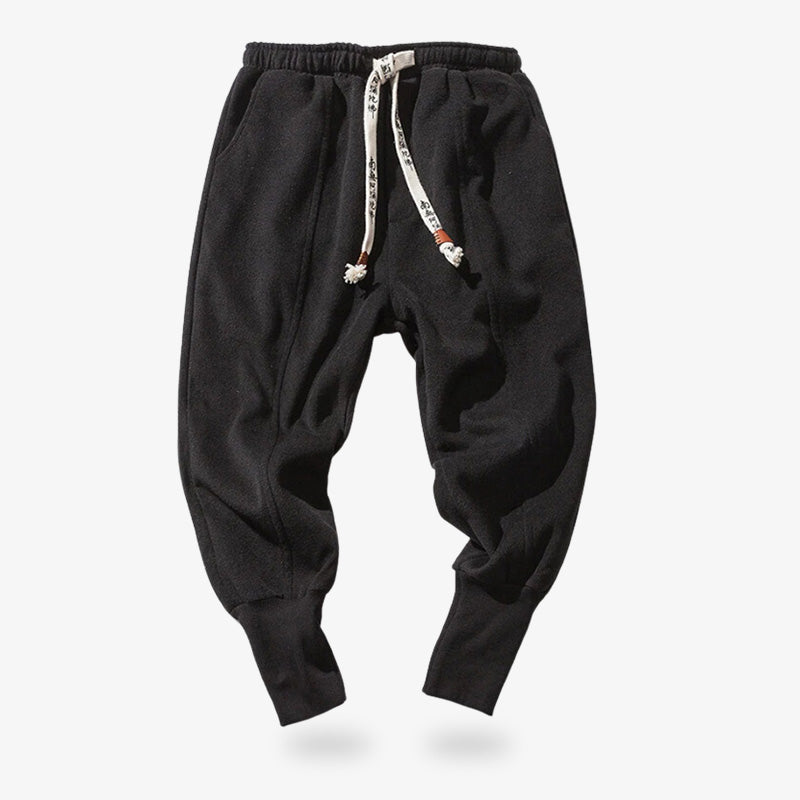 Pantalones Nikka zubon negros anudados con cordones de estilo kanji, ideales para un armario streetwear y zen