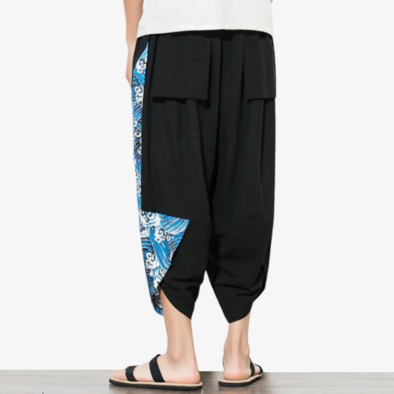 Pantalones negros con motivo de olas azules japonesas