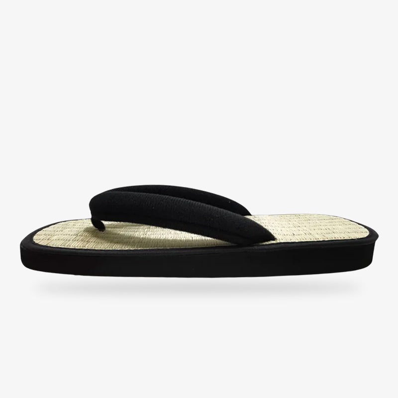 Sandalias japonesas casuales con tira negra y suela trenzada