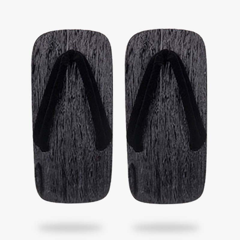 Sandalias japonesas negras de líneas sobrias, versátiles para ocasiones formales y informales