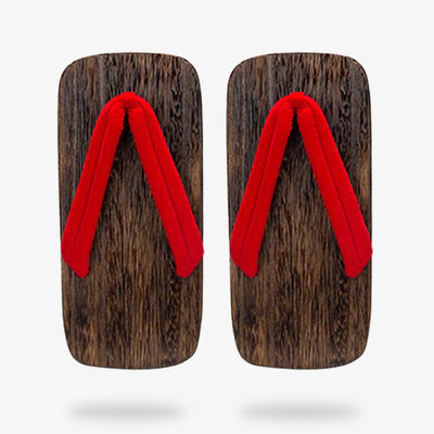 Dos sandalias de estilo japonés hechas a mano con correas rojas